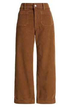 Patch pockets and wide legs add '70s-inspired style to high-waist pants made from soft, comfortable corduroy. 33" inseam; 20 1/2" leg opening; 11 1/4" front rise Zip fly with button closure Front patch pockets 97% cotton, 3% elastane Machine wash, dry flat Made in Turkey Corduroy Pants 70s, 70s Office Fashion, Dark Brown Corduroy Pants, 1970s Pants, Redhead Fashion, Campus Fashion, Corduroy Wide Leg Pants, Campus Style, Brown Jeans