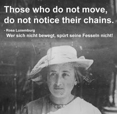 a black and white photo with a woman wearing a hat in front of a sign that says those who do not move, don't notice their chains