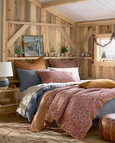 a bed in a room with wooden walls