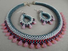 a necklace and earring set with pink beads