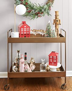 a bar cart with christmas decorations on it