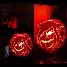 two pumpkins with faces carved into them, one is glowing and the other has an evil face