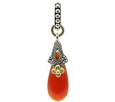 Update your neckline with this unique pendant from Barbara Bixby. A large carnelian cabochon radiates color from beneath a beautiful textured, oxidized sterling silver design and a signature 18K yellow gold flower. From Barbara Bixby. Elegant Carnelian Jewelry With Large Pendant, Elegant Carved Orange Jewelry, Elegant Orange Carved Jewelry, Elegant Engraved Carnelian Jewelry, Silver Design, Gold Flower, Unique Pendant, Drop Pendant, Gold Flowers