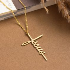 The cross-shaped necklaces with the Jesus inscription symbolize the messages of salvation, mercy, and love in the Christian faith. It can be a meaningful gift option, especially for people who are committed to the Christian faith. Additionally, the cross symbol is often used as a symbol of protection and healing, so this necklace can provide the owner with a sense of protection, hope, and peace. Thanks to its stylish design and meaningful symbolism, this necklace can be chosen as a gift for spec Inspirational Gold Cross Jewelry, Inspirational Gold Cross Necklace, Personalized Yellow Gold Cross Necklace, Minimalist Personalized Gold Cross Necklace, Gift Jewelry Chain With Crucifix Shape, Gold Personalized Minimalist Cross Necklace, Gold Minimalist Personalized Cross Necklace, Minimalist Personalized Cross Pendant Necklace, Gold Cross Pendant Necklace For Mother's Day