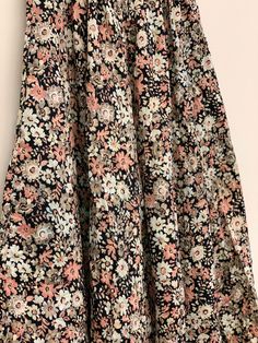 Pleated floral skirt Approximate Size: 12 1/2 W; 33 W Spring Floral Print Full Maxi Skirt, Floral Print Relaxed Midi Skirt, Floral Print Dress With Flowy Flared Skirt, Spring Cotton Skirt With Floral Patchwork, Fall Floral Print Flowy Maxi Skirt, Floral Print Flared Skirt, Ditsy Floral Print Tiered Skirt, Fall Floral Print Tiered Skirt, Flowy Floral Print Maxi Skirt For Fall