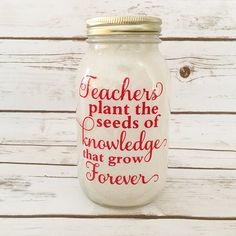 a mason jar with the words teachers plant the seeds of knowledge that grow forever on it