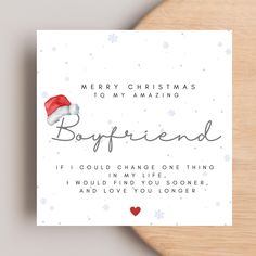 a christmas card with the words boyfriend and santa's hat on it that says, merry christmas to my amazing boyfriend