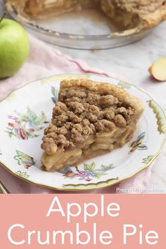 an apple crumble pie on a plate with the title above it in pink and white