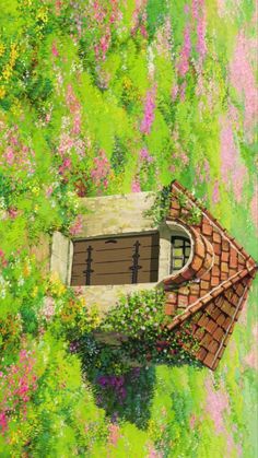 an aerial view of a house in the middle of flowers