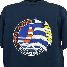 "Tommy Hilfiger Sailing Gear Vintage 90s T Shirt Nautical Sailboat Yacht Blue Made In USA Graphic Tee Condition: Has a light fade. Is a loose fit Large. Would also fit an X-Large. See photos. Size and Measurements: Mens/Unisex Large Width 23.5\" - Underarm to underarm Length 30\" - From the back, measure base of collar to the bottom" Nautical Graphics, Sailboat Yacht, Sailing Gear, Vintage Boats, Summer Ideas, Vintage Tommy Hilfiger, Nautical Fashion, Tommy Hilfiger Man, Vintage Tshirts