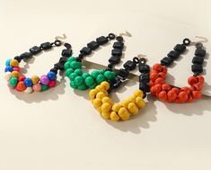 Casual Round Bead Necklaces For Party, Multicolor Wooden Beads Jewelry For Party, Multicolor Wooden Beads Necklaces For Party, Multicolor Party Necklaces With Wooden Beads, Colorful Round Beaded Resin Jewelry, Multicolor Resin Bead Jewelry, Casual Multicolor Jewelry With Black Beads, Wooden Beads Jewelry For Party, Adjustable Beaded Resin Jewelry