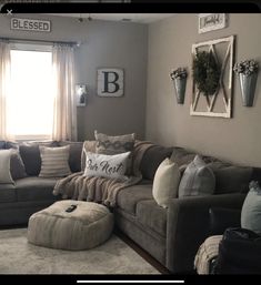 a living room filled with lots of furniture and pillows on top of it's couches