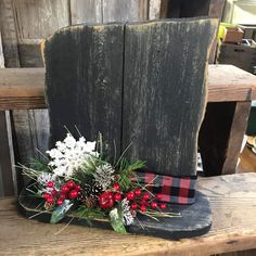 a wooden chair decorated with flowers and greenery