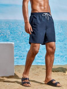 Step up your swimwear game with our Slant Pocket Plain Swim Trunks. Designed specifically with precision, these trunks offer a comfortable fit and masculine style. The slant pockets provide convenient storage for your small essentials, while the high-quality fabric ensures durability and quick-drying capabilities. Features: Style: Boho Pattern Type: Plain Details: Drawstring, Pocket Type: Bottoms Bottom Type: Shorts Fabric: Non-Stretch Care Instructions: Machine wash, do not dry clean Body: Line Navy Swim Trunks With Built-in Shorts For Vacation, Navy Swim Trunks With Built-in Shorts For Beach, Navy Swimwear With Built-in Shorts, Casual Swimwear With Side Pockets For Beach Season, Navy Swimwear With Built-in Shorts For Vacation, Summer Nylon Swim Trunks With Side Pockets, Casual Swimwear With Side Pockets For Beach, Casual Swimwear With Side Pockets For Poolside, Navy Bottoms With Built-in Shorts For Beach