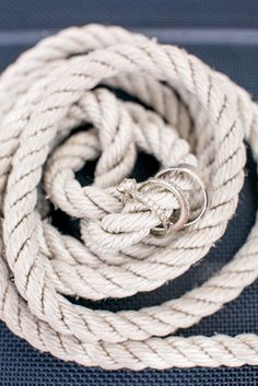 a white rope with two silver rings on it