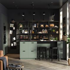 a kitchen with two bar stools in front of it and shelves on the wall