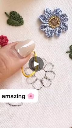 someone is using crochet to make their own flower designs on the tablecloth