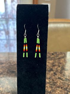 **Christmas orders purchased  by 12/13 will ship by 12/19**                  Beautiful beaded drop earrings perfect for those who like a minimalist design. 2 inches long, including hook. Hand made in Oklahoma by an enrolled citizen of Cherokee Nation. Many primary colors to choose from. Hypoallergenic stainless steel hooks used. Adjustable Beaded Earrings With Dangling Beads For Everyday, Handmade Minimalist Beaded Dangle Earrings, Minimalist Handmade Beaded Dangle Earrings, French Hook Beaded Drop Earrings, Adjustable Dangle Beaded Earrings For Everyday, Minimalist Jewelry With Dangling Round Beads, Minimalist Adjustable Earrings With Dangling Beads, Gift Beaded Long Drop Earrings, Minimalist Beaded Earrings For Everyday