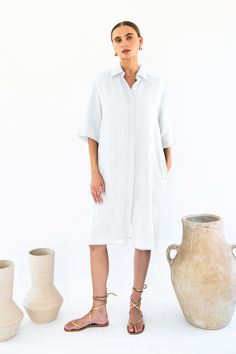 Designed for those who appreciate effortless style and comfort, this dress is a timeless addition to any wardrobe.Crafted from luxurious 100% linen, this shirt dress offers a lightweight and breathable feel, perfect for warm days or layering during cooler evenings. The button-front design exudes classic sophistication, while the sleeves hitting at the elbows add a touch of modern flair.Featuring a shirt collar that lends a polished finish, this dress effortlessly transitions from day to night, making it a versatile staple for any occasion. Whether you're running errands, meeting friends for brunch, or attending a casual gathering, the Neu Nomads Chloe Shirt Dress is sure to turn heads.Pair it with sandals for a relaxed daytime look, or dress it up with heels and statement accessories for a Elegant Relaxed Fit Short Sleeve Linen Dress, Elegant Short Sleeve Linen Dress With Relaxed Fit, Elegant Linen Midi Dress With Relaxed Fit, Elegant Relaxed Fit Linen Midi Dress, Elegant Summer Shirt Dress With Rolled Sleeves, Elegant Summer Linen Dress In Relaxed Fit, Linen Tunic For Day Out, Chic Linen Button-up Dress For The Beach, Chic Linen Dress For Daywear