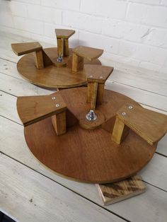 three pieces of wood sitting on top of each other