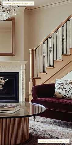 a living room filled with furniture and a fire place in front of a stair case