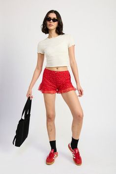 Expertly crafted from a blend of nylon and cotton, the Emory Park Ruffle Jersey Shorts offer a comfortable and stylish addition to your wardrobe. The ruffled detailing adds a feminine touch, while the polyester lining ensures a smooth fit. Imported, and designed to flatter, these shorts are a must-have for any fashion-forward individual. SIZE & FIT :MODEL WEARS SIZE SMALLMODEL'S HEIGHT 5'9 Made In: IMPORTED Fabric Contents: 70% NYLON, 30% COTTONLINING: 100% POLYESTER Bloomer Shorts, Ruffle Bloomers, Bloomers Shorts, Red Rose, Fall Trends, Jersey Shorts, Sweater Jacket, Halloween Shopping, Fashion Forward