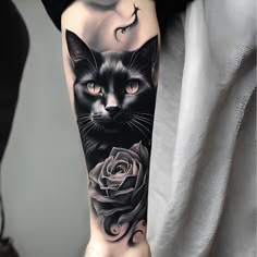 a woman's arm with a black cat and rose tattoo on the left forearm