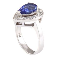 Stamped: 14K White Gold Total Ring Weight: 6.3 Grams Ring Length: N/ARing Width: N/A Gemstone Weight: Total Natural Tanzanite Weight is 2.73 Carat (Measures: 10.50x7.80 mm) Color: Blue Diamond Weight: Total Natural Diamond Weight is 0.40 Carat Quantity: 25 Color: F-G, Clarity: VS2-SI1 Face Measures: 17.30x13.30 mm Sku: [703329W] Classic Tanzanite Ring For Formal Occasions, Formal Pear-shaped Diamond Ring With Halo Setting, Formal Tanzanite Ring With 17 Jewels, Pear-shaped Sapphire Rings For Formal Events, Formal Pear-shaped Rings, Formal Tanzanite Rings With Prong Setting, Tanzanite Rings With 17 Jewels For Anniversary, Fine Jewelry Pear-shaped Diamond Ring For Formal Events, Formal Tanzanite Fine Jewelry Rings