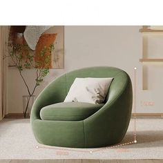 a green chair sitting on top of a hard wood floor next to a white wall