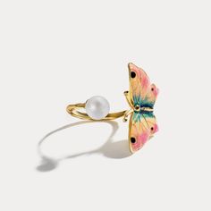 Adjustable Butterfly Ring has an eye-catching butterfly and a bright pearl from Selenichast, a fine jewelry brand. It has delicate details on its 18K gold look, and it’s suitable for any girls as an everyday jewelry. This ring is certainly a unique finger jewelry. Ring For Wedding, Tiny Butterfly, Finger Jewelry, Charm Ring, Butterfly Ring, 18k Gold Ring, Charm Rings, Butterfly Charm, Affordable Jewelry