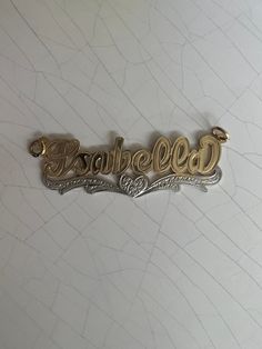 Made in either 10k or 14k real solid gold, our nameplates is personalized and made to order. Necklace is 100% authentic 10k or 14k solid gold heavyweight necklace (not filled-plated or hollow) *Cuban link chain weight approximately: 6-10g *Name charm size approximately: 1.5"x1/5"inches (7 letters max) -how to order: Select: NAME CHARM ONLY OR WITH 3MM NECKLACE SIZE. *3mm necklace size available: 14in,16in,18in,20in,22in,24inches. -shipping:1-4 days -labor: 1-5 days -looking for a different desig Anniversary Nameplate Name Necklace With Hallmarks, Engraved White Gold Custom Nameplate Necklace, Customizable Nameplate Necklace In White Gold, Customizable White Gold Nameplate Necklace, Engraved Custom Nameplate Necklace For Anniversary, Custom 14k Gold Nameplate Necklace, 14k Gold Name Necklace With Heart Pendant, Custom Gold Name Jewelry, Custom Gold Jewelry With Custom Name