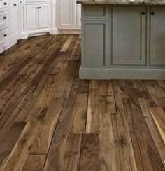 an image of a kitchen with wood flooring on the walls and in the floors