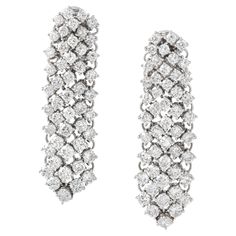 Introducing our Diamond 18K White Gold Earrings—an embodiment of opulence and sophistication. Crafted in radiant 18K white gold, these earrings feature a dazzling array of 96 round-cut diamonds, collectively weighing 9.21 carats. The diamonds boast an exquisite F color and VVS clarity, ensuring a brilliant and scintillating sparkle. The meticulous arrangement of these diamonds forms a captivating design, elevating these earrings to a level of refined elegance. Adorn yourself with the luxury and Luxury Radiant Cut White Gold Diamond Earrings, 18k Gold Earrings, White Gold Earrings, Expensive Jewelry, Round Cut Diamond, Diamond White, Timeless Beauty, Gold Earrings, 18k Gold