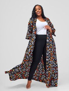 This beautifully designed kimono features a black tribal Ankara print that make a bold fashion statement. Crafted to add a layer of sophistication to any outfit, it's perfect for those who love to mix and match their wardrobe with unique pieces.  - This long Kimono is made from cotton wax African print fabric.  - The Kimono is 62 inches/ 157 cm long  - The model is wearing a UK 14/ US XL. She is 5'5/ 168 cm tall. The Kimono has pockets on both sides and comes with a detachable belt. African Kimono, Kimono Styles, African Print Kimono, Mode Kimono, Kimono Design, Ankara Print, Beautiful Kimonos, Power Dressing, Formal Outfits