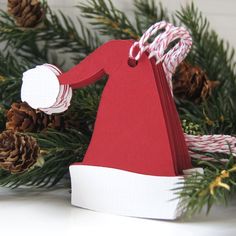 an ornament made to look like a woman in a red dress and hat