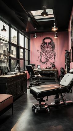 a room with pink walls and lots of black furniture in it, including an office chair