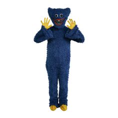 a person in a blue monster costume with yellow hands on his chest and mouth open