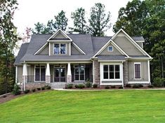 a house that is sitting in the grass