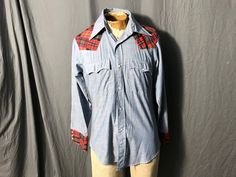 "Vintage cowboy shirt, tag says Levi's, sz M, 50% cotton, 50% Kodel polyester, trim 65% polyester 35% cotton. Shirt is soft, blue in color with red plaid detailing, and white pearl buttons. Shirt is in great condition, measurements are Shoulder to shoulder 19\" Under arms 21\" across Waist 18\" across Length 27\" Sleeve length 24\"" Jean Levis, Boy Vintage, Cowboy Shirt, Shirt Tag, Jean Vintage, Cowboys Shirt, Vintage Cowboy, Cowboy Western, Cow Boy