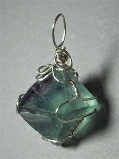 Fluorite Octahedron Crystal Pendant Wire Wrapped .925 Sterling Silver – Jemel Silver Sterling Wire Wrapped Crystal Necklaces, Iridescent Amethyst Jewelry For Gift, Iridescent Amethyst Jewelry Gift, Wire Wrapped Crystal Necklace In Sterling Silver, Silver Wire Wrapped Mineral Crystal Necklaces, Silver Fluorite Jewelry As A Gift, Silver Fluorite For Jewelry Making, Silver Fluorite Jewelry With Natural Stones, Unique Green Wire Wrapped Crystal Necklaces