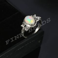 100% Natural Ethiopian Opal Ring ------------------------------------------------------- ♥ Stone  :  Ethiopian Opal ♥ Shape  :  Oval ♥ Weight  : 11.1 ♥ Size   : 9-7 mm  ♥ Cut Grade  :  Excellent ♥ Metal  : 925 Sterling Silver  ♥ Metal Purity : 925 per 1000 stamped ♥ Transparency  :  Opaque ♥ Modified Item  :  No ♥ Country of Origin  :  Ethiopia ♥ Natural/Lab-Created  :  Natural ♥ Country/Region of Manufacture  :  India ♥About gemstones-Opal is birthstone for October. It is linked to the element Boho Opal Ring, Natural Opal Ring, Fire Ring, Ethiopian Opal Ring, Ring Stone, Opal Ring, Natural Opal, Ring Ring, Boho Rings