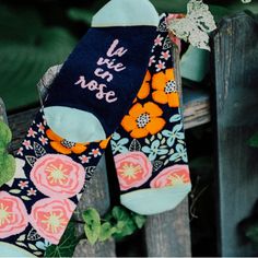 These colorful, vibrant and cheery socks are the perfect gift for the person with a great appreciation for a beautiful garden and the love of life! La Vie En Rose can be translated as "Life in happy hues", or "Life seen through rose-colored glasses." The ultimate in style and comfort. These socks are made with high quality woven cotton that feels soft and luxurious. Additionally, these socks feature extra padding in the toes and heels to make your feet extra happy! Words on Feet: "La Vie en Rose Fun Multicolor Socks For Gifts, Cute Multicolor Socks For Gifts, Multicolor Socks As Summer Gift, Multicolor Socks For Summer Gifts, Comfortable Multicolor Socks As Gift, Comfortable Multicolor Socks For Gifts, Pink Comfortable Socks For Gift, Comfortable Pink Socks For Gift, Comfortable Pink Socks For Gifts