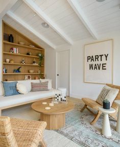 a living room filled with furniture and a painting on the wall above it that says party wave