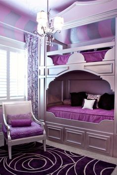 a bunk bed with purple sheets and pillows in a room that looks like it has been made into a child's bedroom