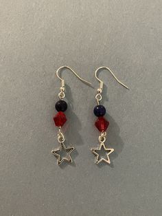 A beautiful patriotic earring set with a star center piece.  The red stone is crystal, the blue stone is jade.   Bracelets for Benjamin. Blue Patriotic Earrings For Independence Day, Patriotic Blue Earrings For Independence Day, Patriotic Drop Earrings For 4th Of July, Patriotic Red Star-shaped Earrings, Red Sterling Silver Star-shaped Jewelry, Red Star Shaped Sterling Silver Jewelry, Red Star-shaped Beaded Jewelry, Red Star-shaped Sterling Silver Jewelry, Adjustable Red Patriotic Earrings