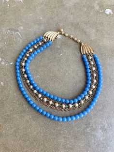 50's Vintage Blue Beads and chain Choker Necklace Condition: Good Vintage Condition, see photos Vintage Multi-strand Beaded Chain Necklaces, Elegant Blue Beaded Necklaces With Chain, Vintage Beaded Necklaces For Party, Vintage Blue Double Strand Jewelry, Vintage Multi-strand Beaded Chain Jewelry, Blue Double Strand Necklaces For Party, Retro Beaded Chain Jewelry With Round Beads, Blue Double Strand Necklace For Party, Vintage Blue Double Strand Necklaces