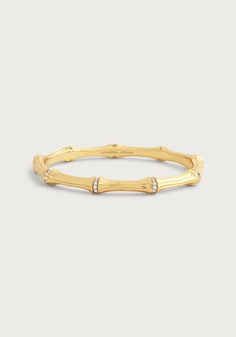 Sculpted from 18k gold dipped brass adorned with sparkling crystals, the hinged bangle closes with a secure hidden clasp worthy of fine jewelry. Bamboo Jewelry, Bangle Designs, Gold Dipped, Hinged Bangle, Sparkling Crystal, Gold Bangles, Bracelet Designs, Luxury Designer, Shop Earrings