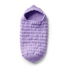 a purple crocheted bag hanging from the side