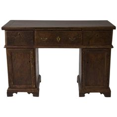 an old wooden desk with two drawers on one side and a drawer on the other