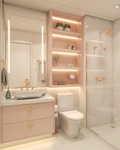 a bathroom with a sink, toilet and shower stall in the background is illuminated by lights